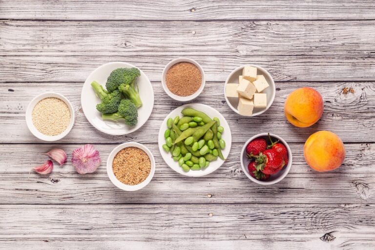 A diverse selection of healthy foods for diabetes management, like vegetables, fruits, whole grains, and lean protein, arranged on a table