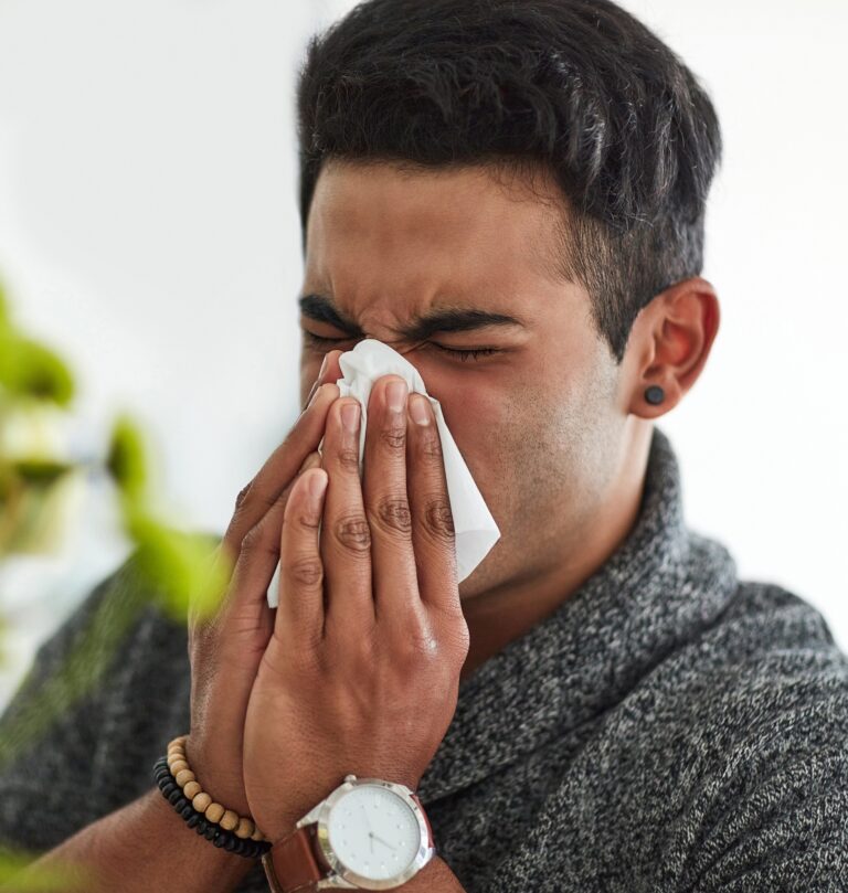 Its flu season. Cropped shot of a young man suffering with allergies